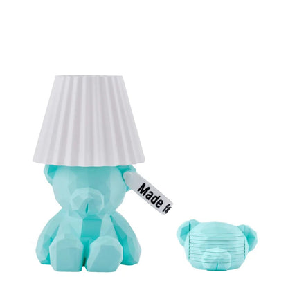 aquamarine teddy boi bear-shaped lamp and a matching coasters with a white shade on a white background