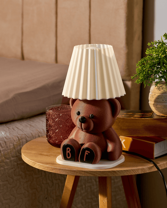 3D printed personalized brown teddy bear lamp with custom initials on the paws.