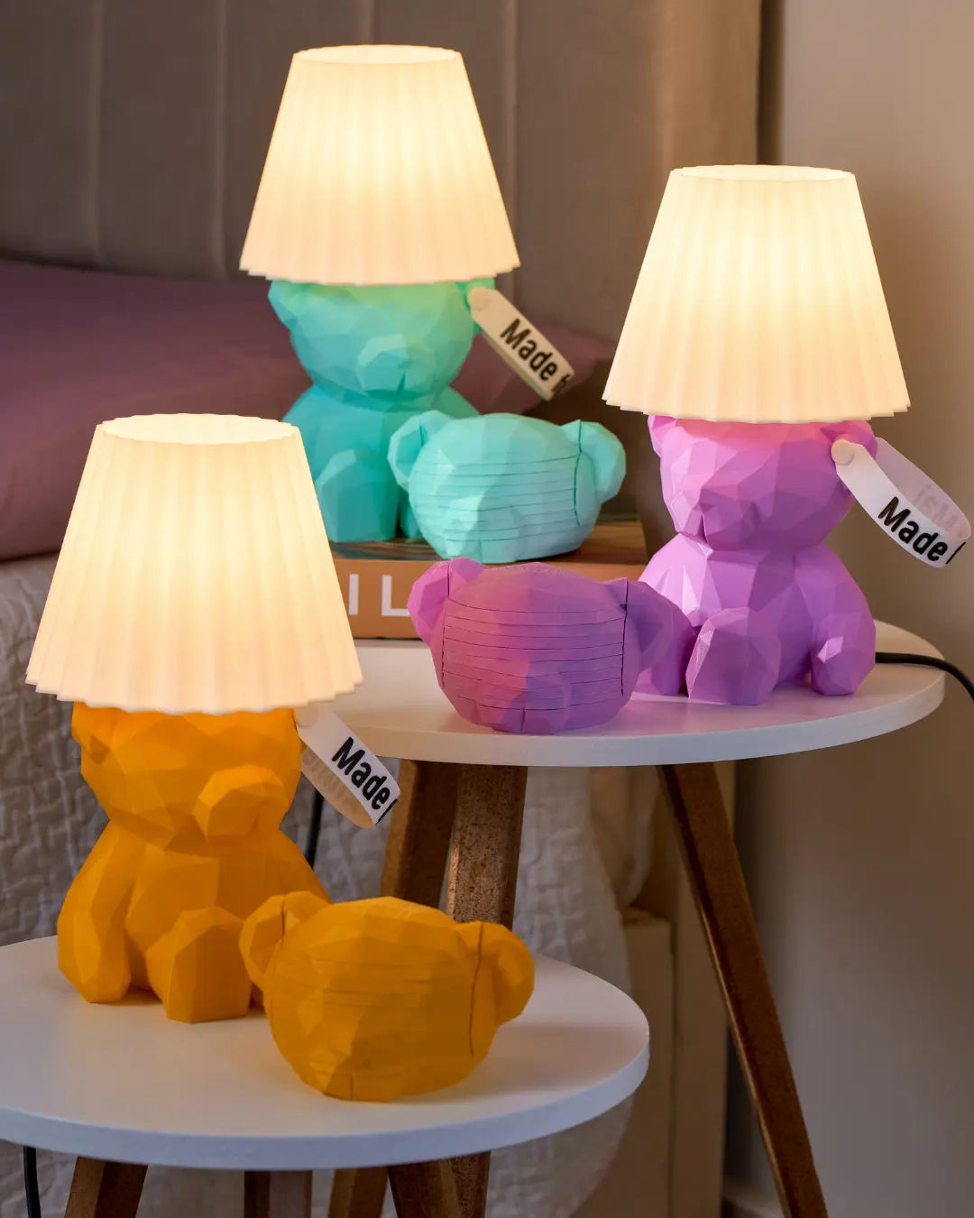 Colorful teddy boi bear-shaped lamps on a table with a neutral background  and matching coasters bundle sets