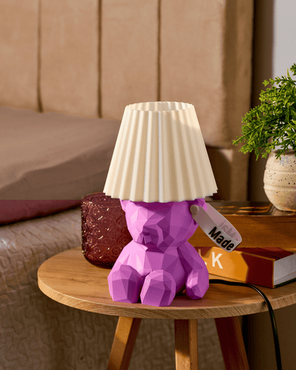 aquamarine 3D printed teddy bear lamp with a personalized name tag on the ear in a wooden table