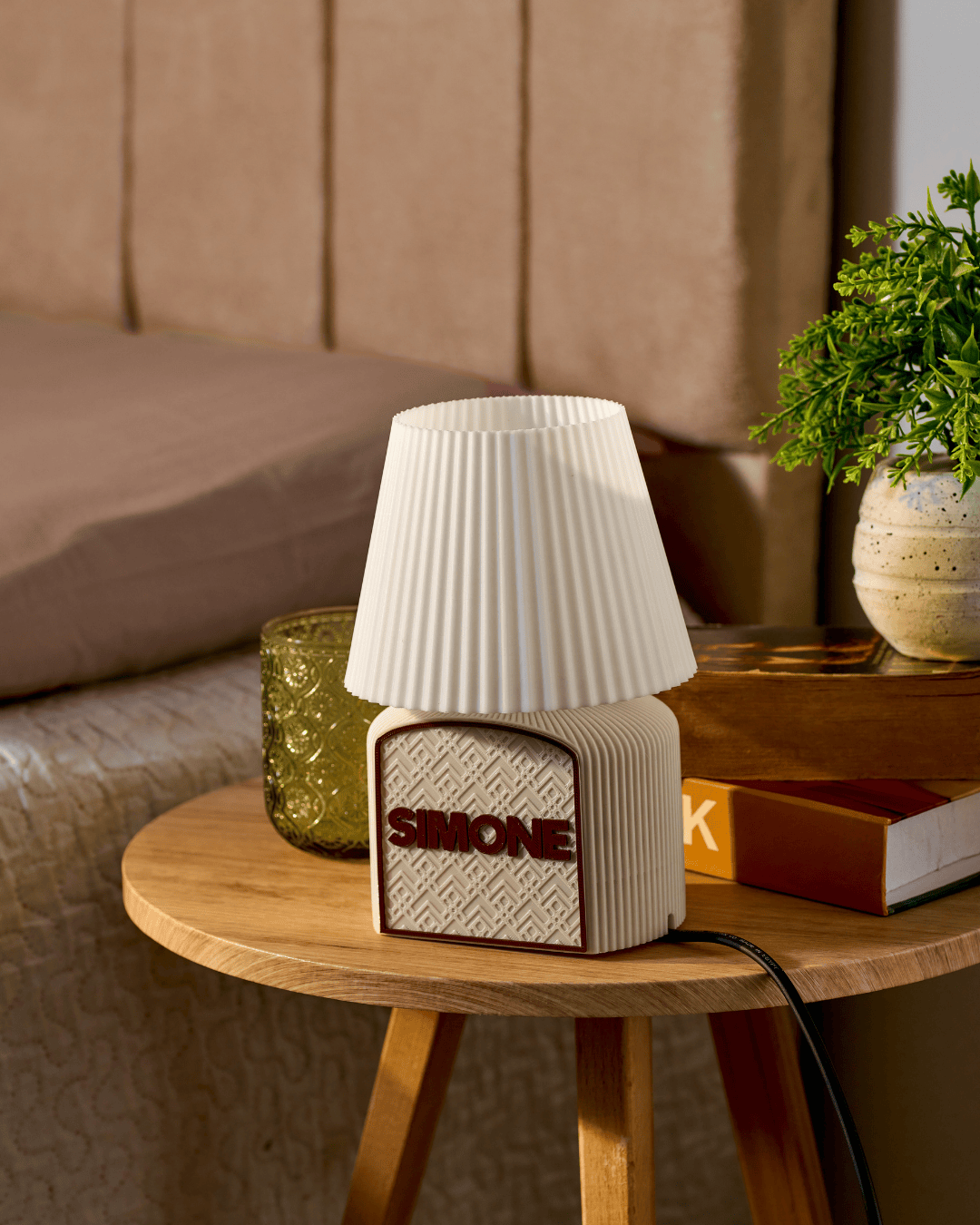 Art Deco glow Table lamp with textured design on a wooden side table in a cozy room setting.